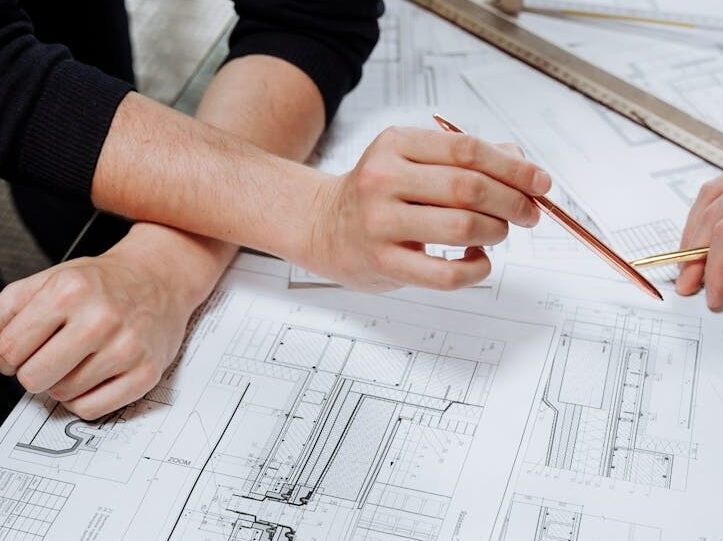 close up photo of an architect planning a schematic diagram